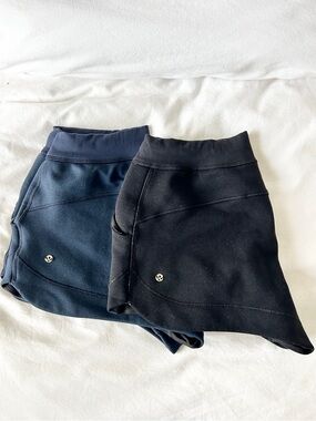 2 pairs- lululemon athletica Navy Blue and Black Fleece Shorts